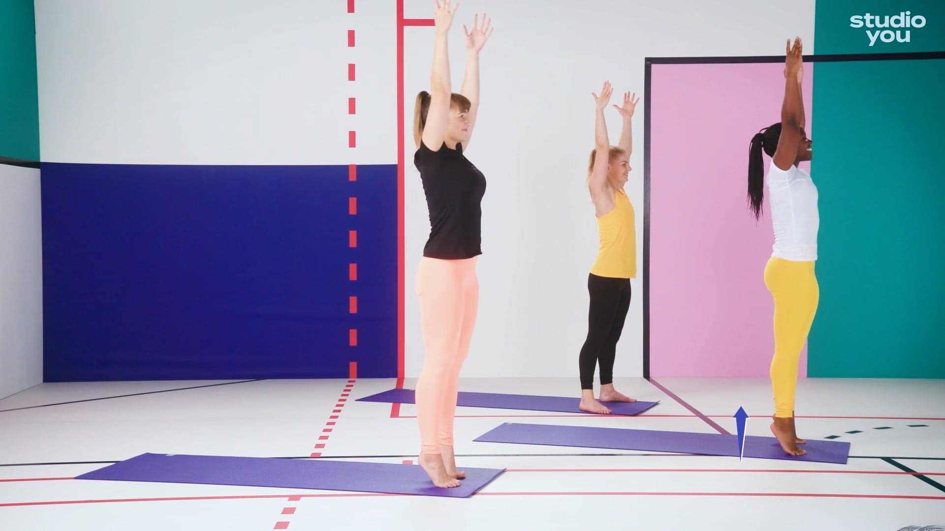 Three women stood up stretching