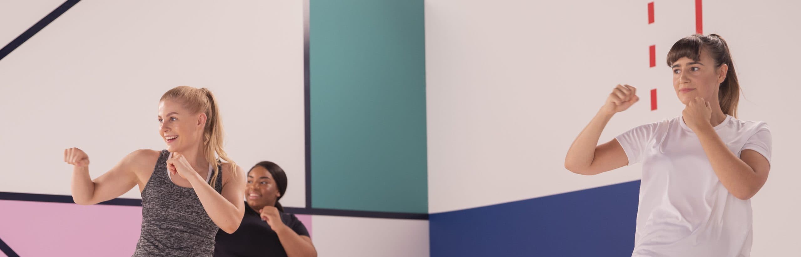 Three women in a boxing pose